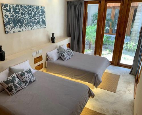 Postel nebo postele na pokoji v ubytování Hotel Casa Margot