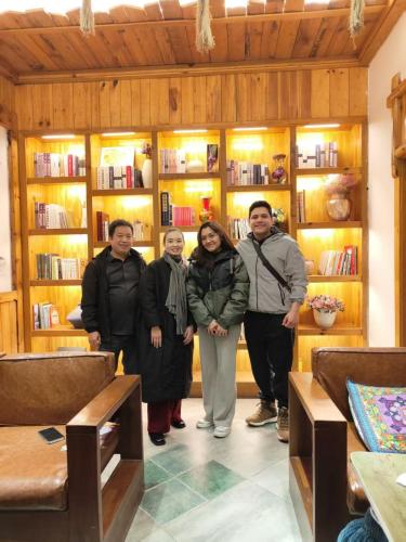 a group of people standing in a room at Chong Chong Guesthouse in Zhangjiajie