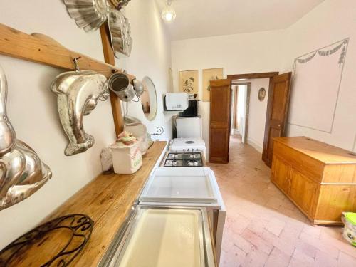 a kitchen with a stove and a counter top at Adam House - beautiful exc Pool - sleeps 8 in Marzolini
