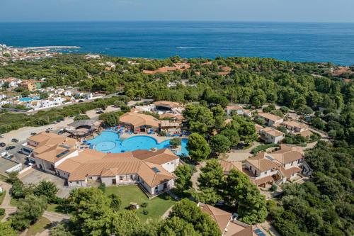an aerial view of a home with a swimming pool at Club Esse Cala Gonone in Cala Gonone