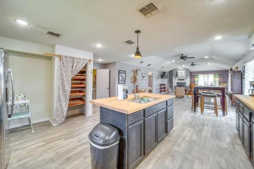 a kitchen and living room with a island in the middle at Outdoorsy Getaway Near Atoka Hunt, Fish and Relax! in Atoka