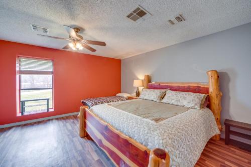 a bedroom with a bed and a ceiling fan at Outdoorsy Getaway Near Atoka Hunt, Fish and Relax! in Atoka