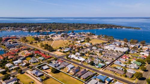 an aerial view of a town next to the water at Armstrong Cottage in Paynesville