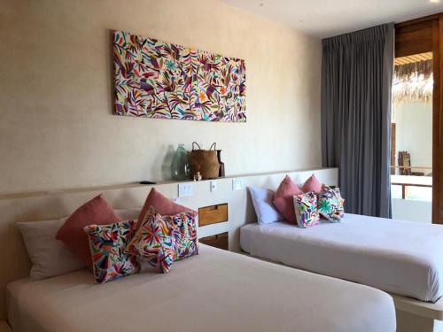 Postel nebo postele na pokoji v ubytování Hotel Casa Margot