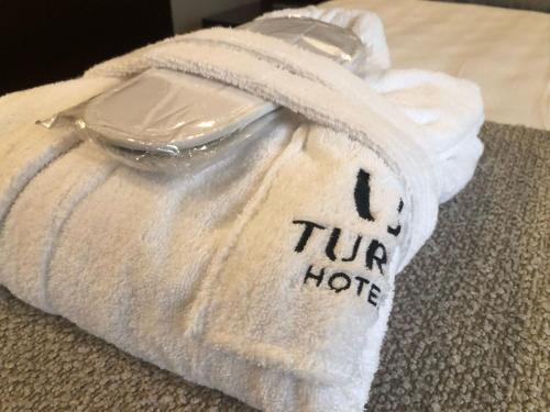 a towel that is sitting on top of a table at Turia Granada in Granada