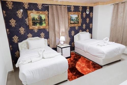 Postel nebo postele na pokoji v ubytování Capital O 141 Golden Rays Hotel