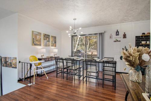 a kitchen and dining room with a table and chairs at Charming Elegance Getaway in Omaha
