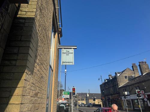 a street sign on the side of a building at Sowerby Apartment in Sowerby Bridge