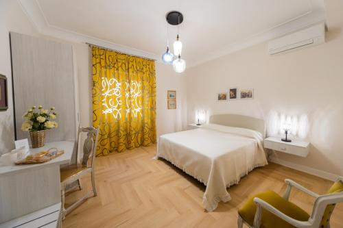 Ένα ή περισσότερα κρεβάτια σε δωμάτιο στο AeP House Pompei