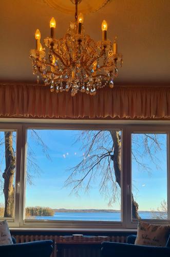 a large window with a view of the water at Exklusive Ferienwohnung Strohberg in Plön