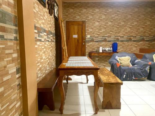 a living room with a table and a couch at Mountain Villa View Three spacious bedrooms in Baguio