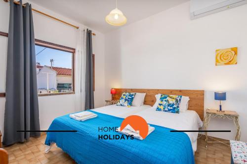 Giường trong phòng chung tại #241 Old Town - Casa de Albufeira 1 by Home Holidays