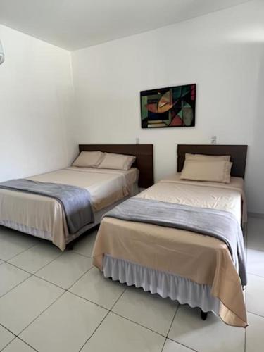 Katil atau katil-katil dalam bilik di Vila Lençóis Residence