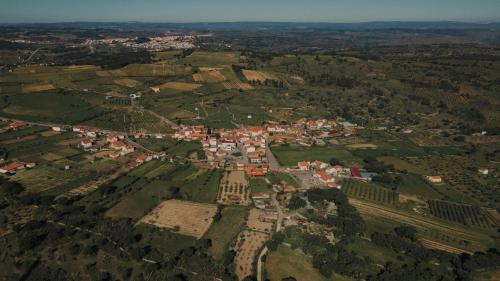 an aerial view of a town in a city at Centro Rewilding in Vale de Madeira