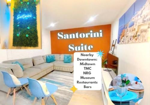 a living room with a white couch and blue chairs at Luxury Midtown Suite in Houston near TMC and NRG in Houston