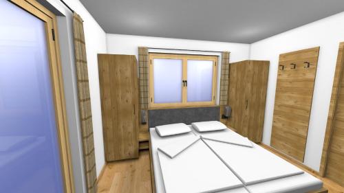 ein Zimmer mit Holztüren und einem Bett darin in der Unterkunft Boderhof Apartments in Tux