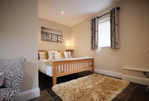 Postel nebo postele na pokoji v ubytování Swallows Nest Cottage