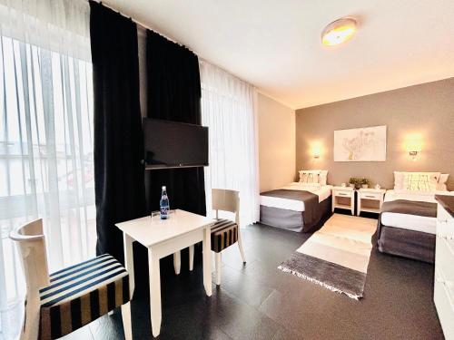 Postel nebo postele na pokoji v ubytování HOTEL Amber Suite & SPA - Enklawa dla Dorosłych