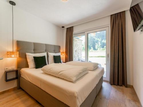 Ένα ή περισσότερα κρεβάτια σε δωμάτιο στο Tauernlodge Eben E1