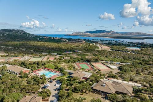 an aerial view of a resort with a pool at Club Esse Sporting in Stintino