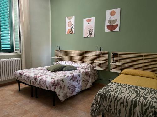 a bedroom with two beds in a room at Da Linda Appartamento in Livorno
