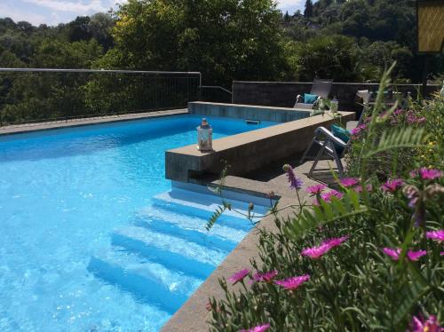a swimming pool with a fire hydrant sitting on top of it at Casa Lucciola by Fewotessin in Contra