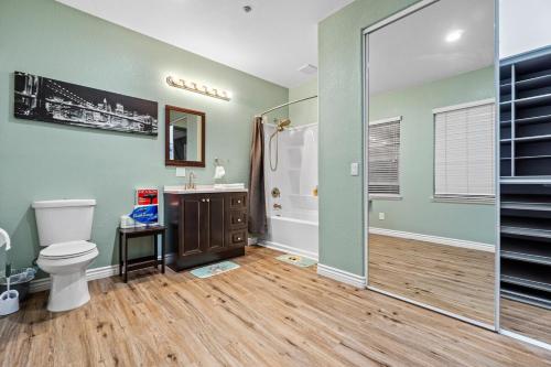 a bathroom with a toilet and a shower and a sink at Entire Private 5-BR Villa w Pool, Spa, Nature, 3000 sq ft, Private Rental, Available Now in Fallbrook