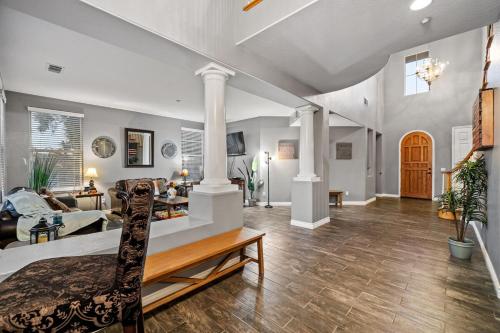 a living room with a bed and a couch at Entire Private 5-BR Villa w Pool, Spa, Nature, 3000 sq ft, Private Rental, Available Now in Fallbrook