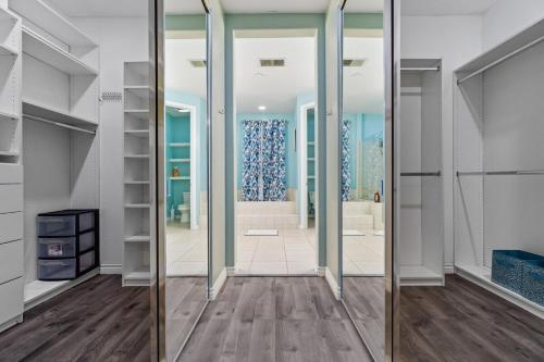 a hallway with mirrors in a home with a living room at Entire Private 5-BR Villa w Pool, Spa, Nature, 3000 sq ft, Private Rental, Available Now in Fallbrook