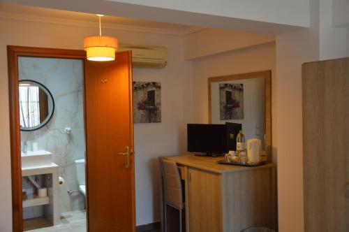 TV a/nebo společenská místnost v ubytování Aqua Mare Sea Side Rooms