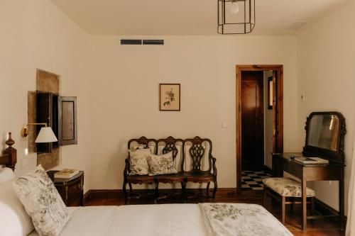 Postel nebo postele na pokoji v ubytování Hotel PAX Casona del Busto