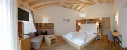 Ένα ή περισσότερα κρεβάτια σε δωμάτιο στο Hotel Stoeres - Active wellbeing