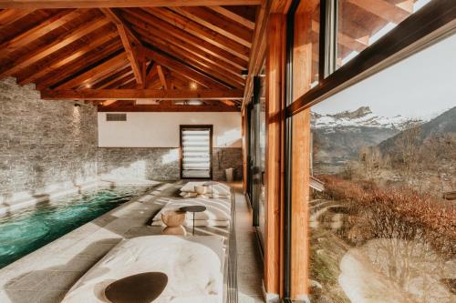 a spa room with a view of the mountains at Hôtel Restaurant La Ferme de Cupelin in Saint-Gervais-les-Bains