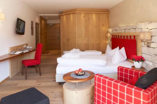 Ένα ή περισσότερα κρεβάτια σε δωμάτιο στο Hotel Stoeres - Active wellbeing