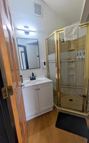 a bathroom with a sink and a shower at Edge-O-Dells Resort in Wisconsin Dells
