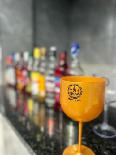 a yellow cup sitting on top of a counter at Pousada Hércules Beach Paradise in Maragogi