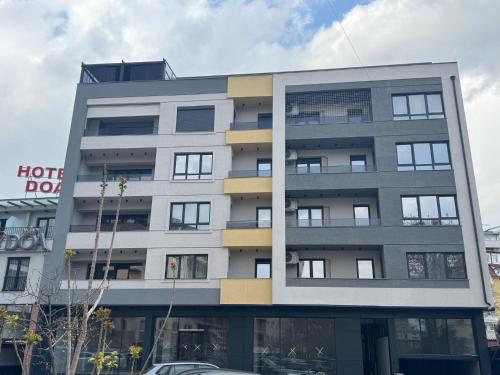 a large apartment building with a lot of windows at Liri's Home in Skopje