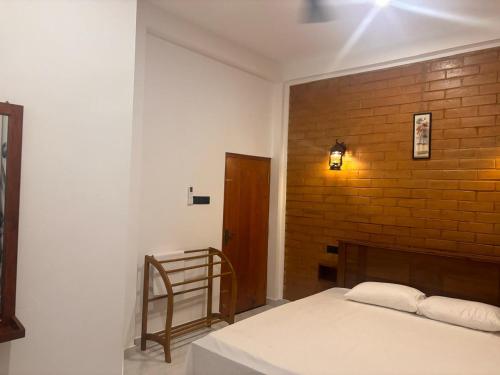 Voodi või voodid majutusasutuse Isuru Villa Weligama toas