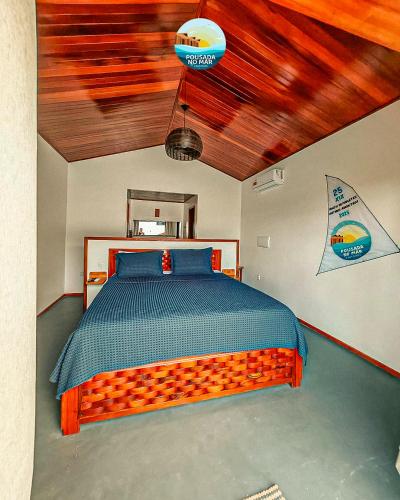 a bedroom with a large orange bed in a room at Pousada no Mar in Amontada