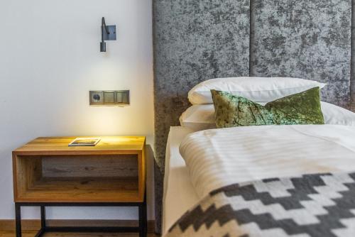 Ένα ή περισσότερα κρεβάτια σε δωμάτιο στο Hotel Stoeres - Active wellbeing
