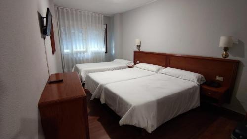 Posteľ alebo postele v izbe v ubytovaní Hotel Maycar