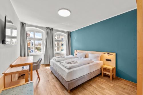 Postel nebo postele na pokoji v ubytování Hotel Friedrichstadt