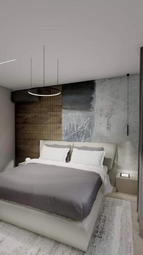 a bedroom with a large bed and a wall at Apartments Pasalic in Kaštela