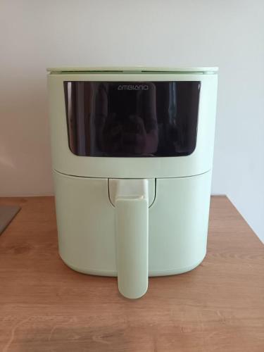 a microwave sitting on top of a food processor at Emville Lodge in Galway