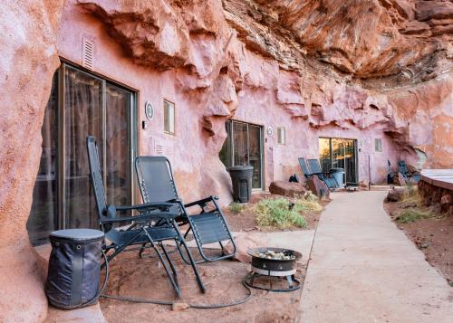 a group of chairs sitting outside of a building at Primal Resorts in Allen Memorial Hospital Heliport