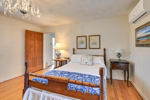 a bedroom with a bed and a chandelier at Georgetown Home Near Kentucky Horse Park! in Georgetown