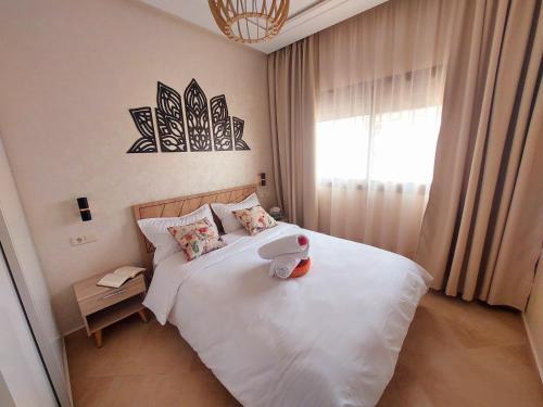 Postel nebo postele na pokoji v ubytování Safari Stay Appart front mer avec piscine