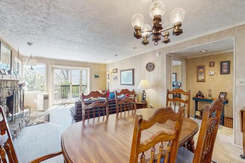 a dining room and living room with a table and chairs at Glen N51 in Sugar Mountain
