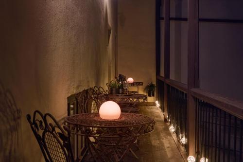 a row of tables on a balcony at night at Latran House 71 by KH in Český Krumlov