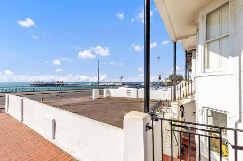 a balcony of a building with a view of the ocean at Seaside Gem Apartment By My Getaways in Brighton & Hove